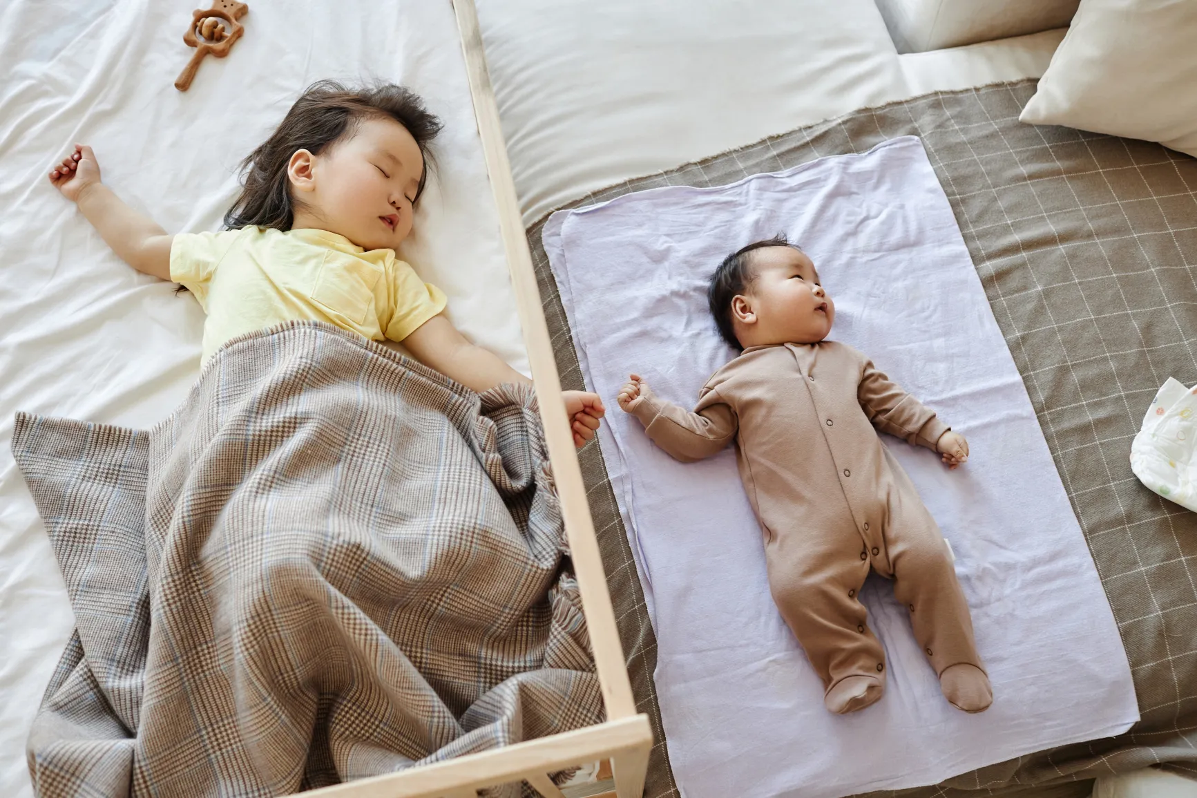 Baby and sibling napping